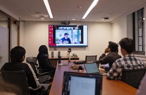 Conference room with a tv zoom meeting