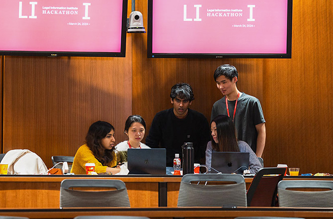 Students working in group in front of Hackahton sign